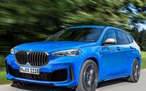versand BMW - Gratis Kofferraummatte X1